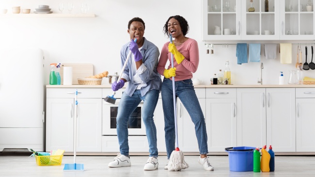 How to Clean Your Home After a Party joyful-african-american-family-having-fun-while-cleaning